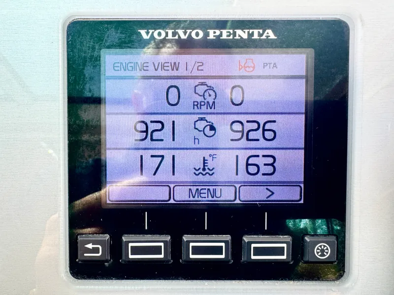 Slide: The Image of Volvo Penta engine display showing hours and temperature. - 44