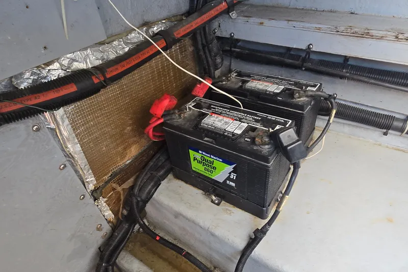 Slide: The Image of Batteries in a 1992 Sea Ray 380 Sun Sport boat engine compartment. - 33