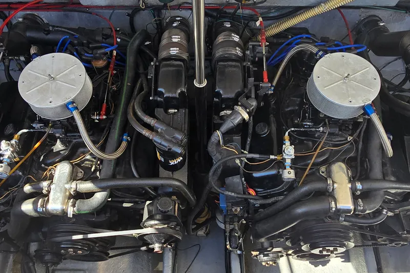 Slide: The Image of Twin engines of a 1992 Sea Ray 380 Sun Sport boat, showcasing intricate mechanical details. - 29