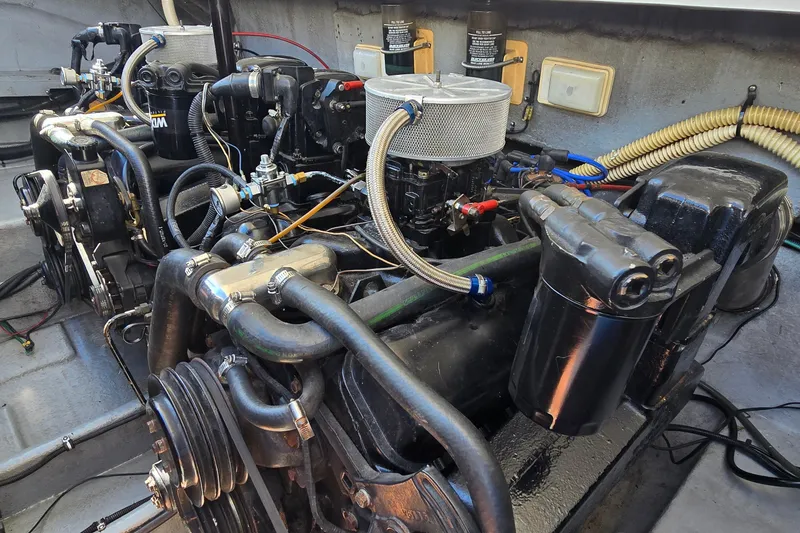 Slide: The Image of Engine compartment of a 1992 Sea Ray 380 Sun Sport boat, showcasing mechanical components. - 32