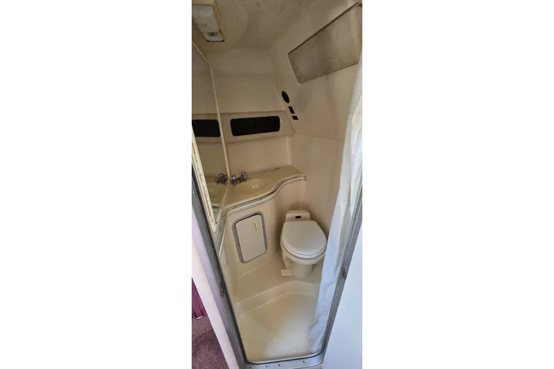 Slide: The Image of 1992 Sea Ray 380 Sun Sport boat bathroom with toilet and sink. - 22