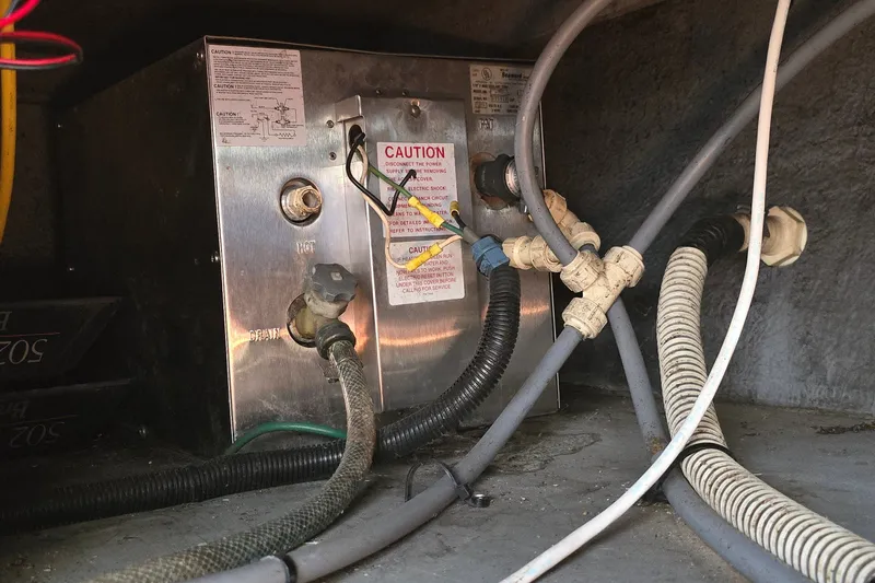 Slide: The Image of Engine compartment of a 1992 Sea Ray 380 Sun Sport with wiring and caution labels. - 27