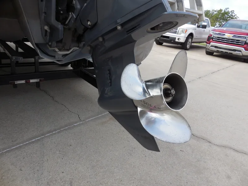 Slide: The Image of Close-up of a boat propeller on a trailer, surrounded by vehicles. - 12