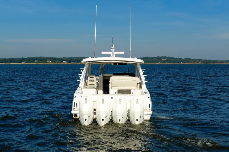 Slide: The Image of 2020 Boston Whaler 380 Realm cruising on open water, rear view. - 9