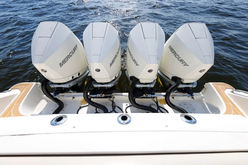 Slide: The Image of 2020 Boston Whaler 380 Realm with four Mercury outboard engines on water. - 30
