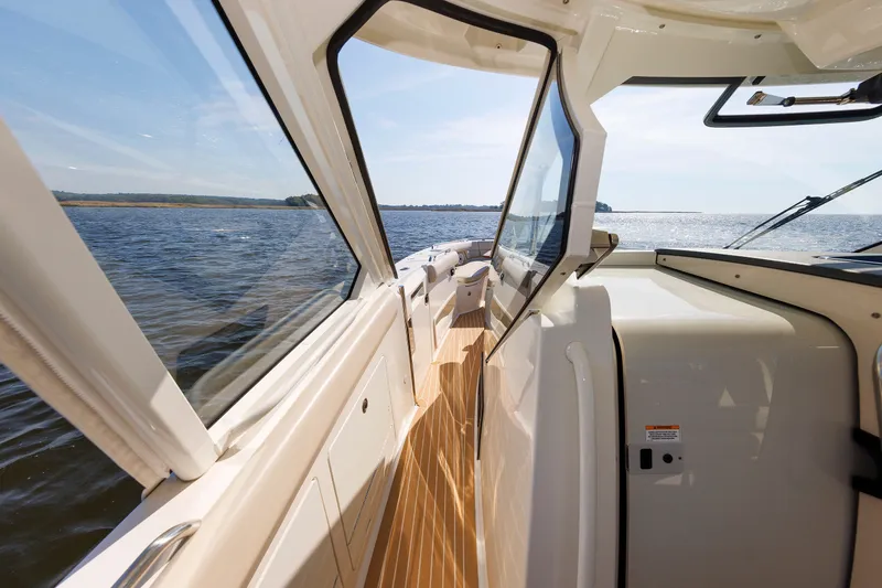 Slide: The Image of 2020 Boston Whaler 380 Realm boat interior with ocean view, showcasing sleek design and craftsmanship. - 56