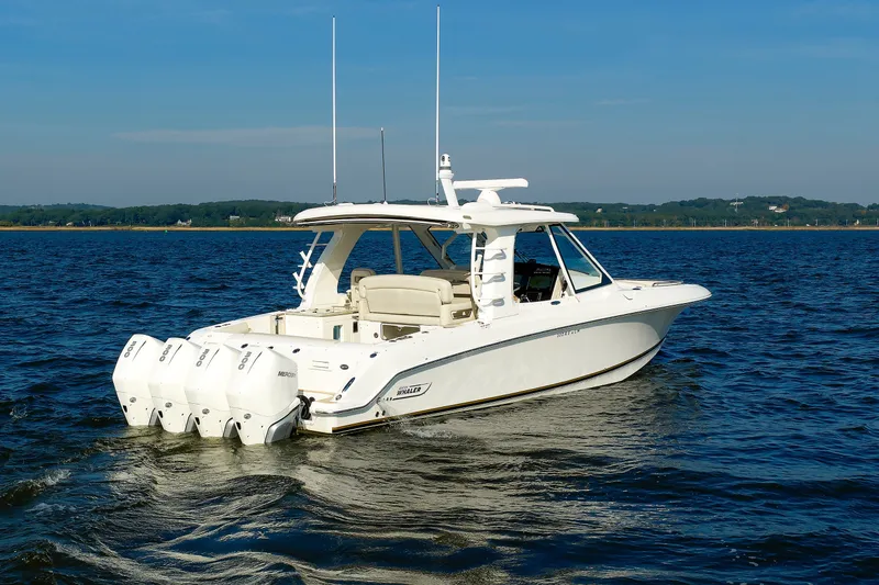 Slide: The Image of 2020 Boston Whaler 380 Realm boat cruising on open water. - 10