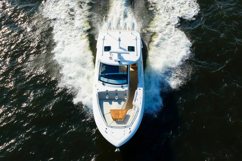 Slide: The Image of Aerial view of 2020 Boston Whaler 380 Realm cruising on water. - 23