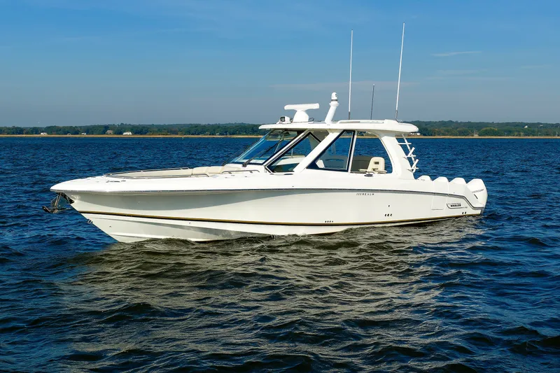 Slide: The Image of 2020 Boston Whaler 380 Realm boat cruising on open water under clear skies. - 5