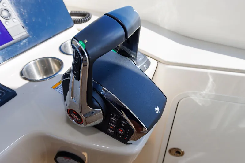 Slide: The Image of Throttle control on a 2020 Boston Whaler 380 Realm boat dashboard. - 54