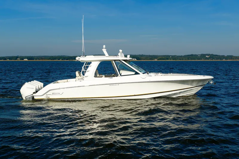 Slide: The Image of 2020 Boston Whaler 380 Realm boat cruising on open water under clear skies. - 12
