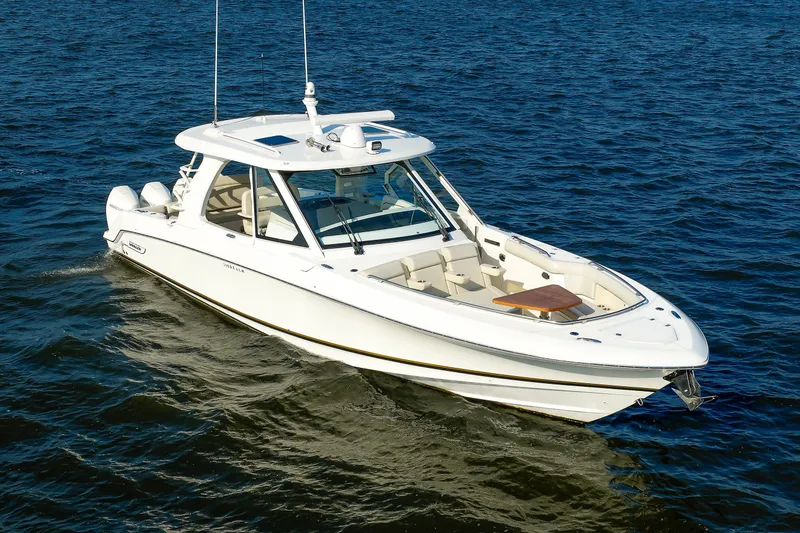 Slide: The Image of 2020 Boston Whaler 380 Realm boat cruising on open water. - 2