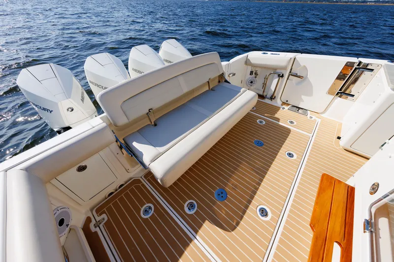 Slide: The Image of 2020 Boston Whaler 380 Realm boat deck with seating and multiple outboard engines. - 33