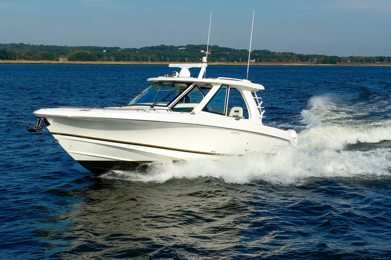 Slide: The Image of 2020 Boston Whaler 380 Realm cruising on open water, showcasing sleek design and performance. - 21