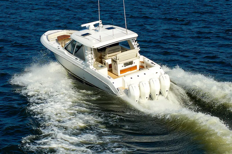 Slide: The Image of 2020 Boston Whaler 380 Realm cruising on open water, showcasing powerful engines. - 25