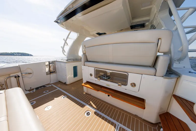 Slide: The Image of 2020 Boston Whaler 380 Realm boat interior with seating and ocean view. - 40