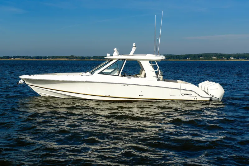 Slide: The Image of 2020 Boston Whaler 380 Realm boat cruising on open water under clear skies. - 7