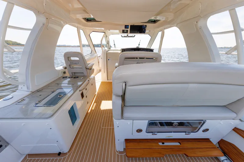 Slide: The Image of Interior view of 2020 Boston Whaler 380 Realm boat, featuring luxurious seating and modern amenities. - 44