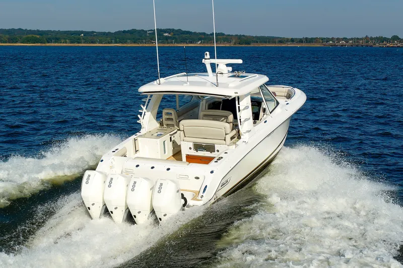 Slide: The Image of 2020 Boston Whaler 380 Realm cruising on open water with powerful engines. - 16