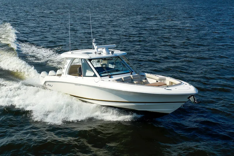 Slide: The Image of 2020 Boston Whaler 380 Realm cruising on open water, showcasing sleek design and performance. - 24