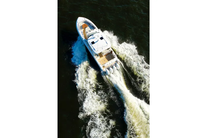 Slide: The Image of Aerial view of 2020 Boston Whaler 380 Realm cruising on water. - 22