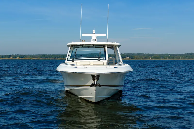 Slide: The Image of 2020 Boston Whaler 380 Realm boat on open water, front view. - 3