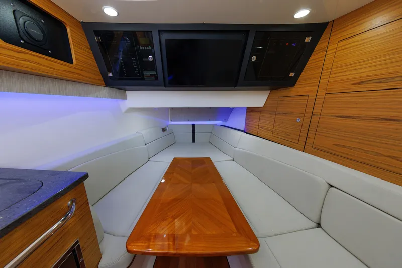 Slide: The Image of Luxurious interior of 2020 Boston Whaler 380 Realm with sleek wood finishes and modern seating. - 72