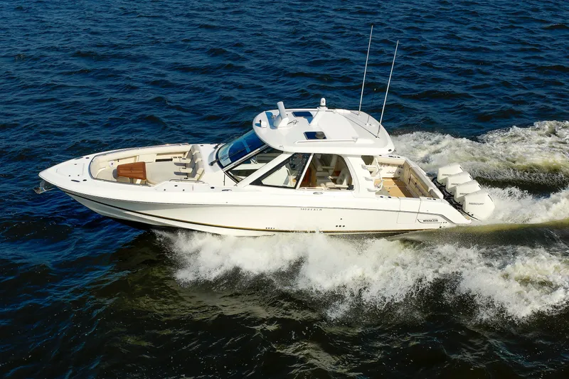 Slide: The Image of 2020 Boston Whaler 380 Realm cruising on open water, showcasing sleek design and powerful engines. - 20