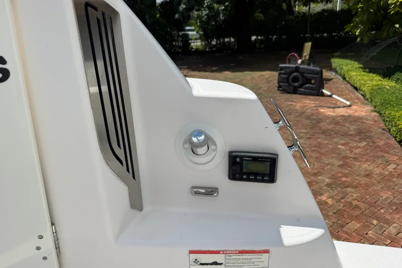 Slide: The Image of 2019 Regal 33 SAV boat dashboard with Fusion stereo system and control panel. - 41