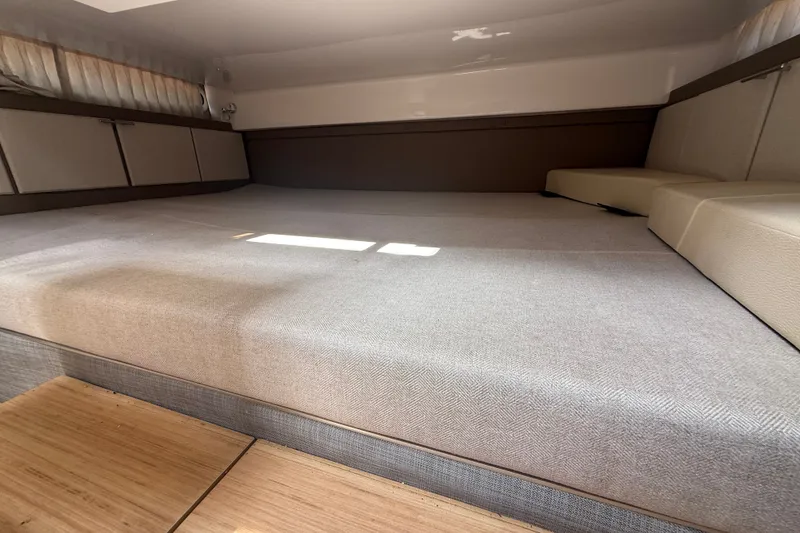 Slide: The Image of 2019 Regal 33 SAV interior cabin with spacious bed and modern design. - 20