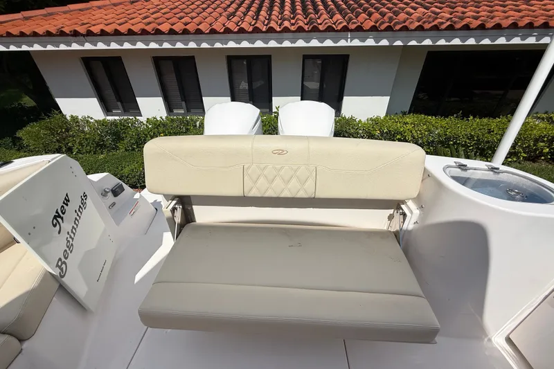 Slide: The Image of 2019 Regal 33 SAV boat with beige seating, "New Beginnings" text, and a tiled roof background. - 39