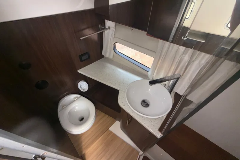 Slide: The Image of Modern bathroom interior of 2019 Regal 33 SAV boat with sink and toilet. - 23