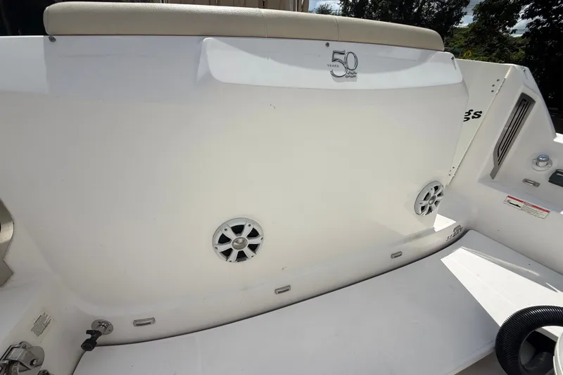 Slide: The Image of 2019 Regal 33 SAV boat deck with speakers and seating, celebrating 50 years. - 44