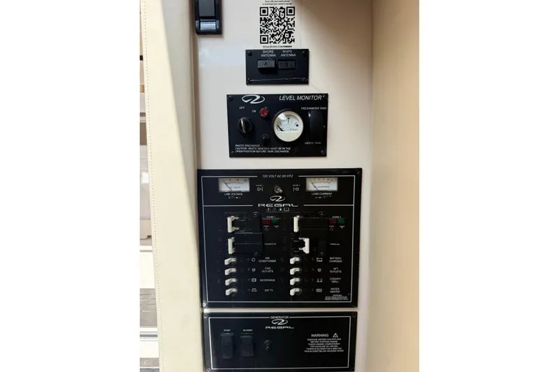 Slide: The Image of Control panel of a 2019 Regal 33 SAV boat with level monitor and switches. - 37