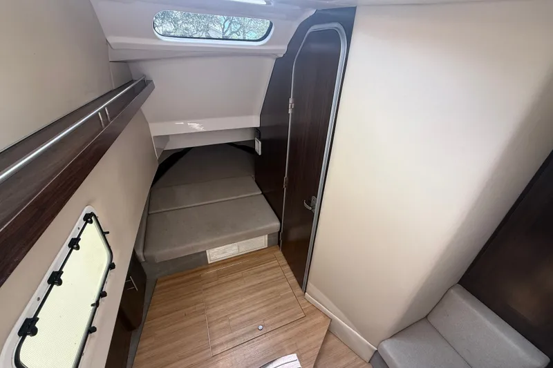 Slide: The Image of Interior cabin of 2019 Regal 33 SAV boat with wood flooring and seating. - 17