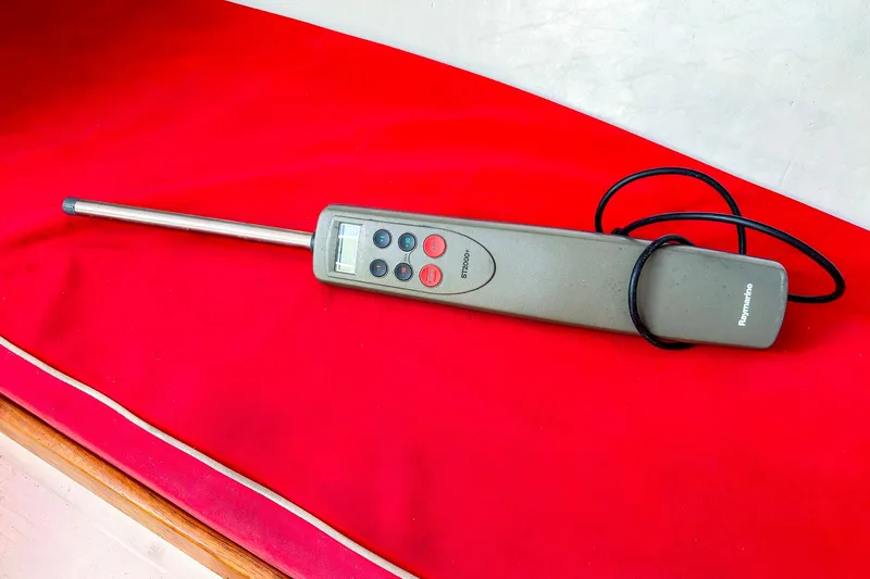Slide: The Image of Raymarine ST2000+ autopilot on red cushion, J Boats J/100, 2005 model. - 23