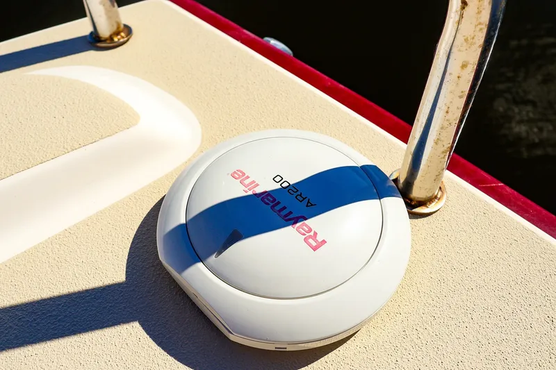 Slide: The Image of Raymarine AR200 sensor on 2005 J Boats J/100 deck, near metal railing. - 13