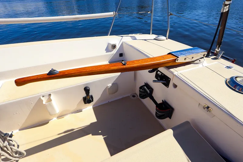 Slide: The Image of Cockpit of 2005 J Boats J/100 sailboat with wooden tiller and water view. - 8