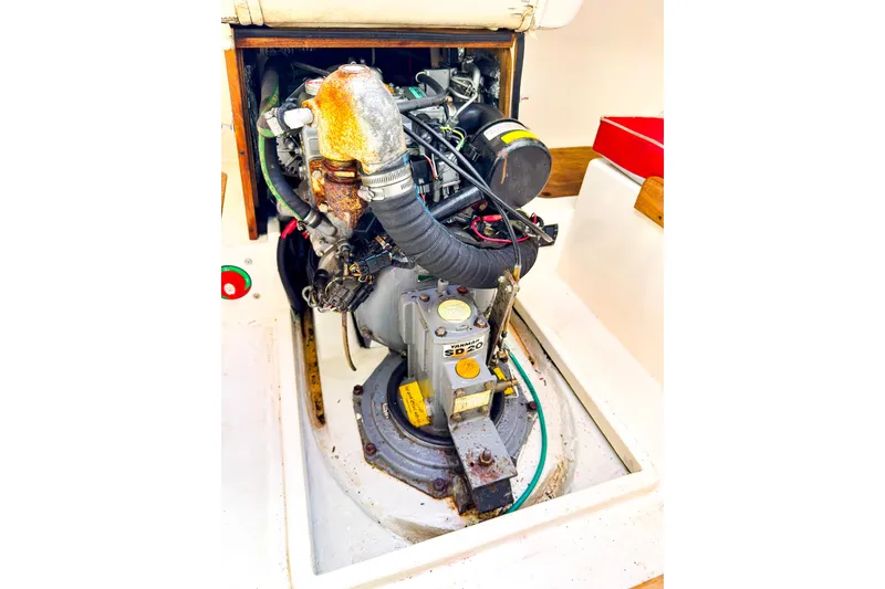 Slide: The Image of Engine compartment of a 2005 J Boats J/100 sailboat, featuring a Yanmar SD20 engine. - 21