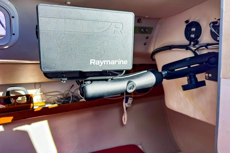 Slide: The Image of Raymarine navigation equipment inside a 2005 J Boats J/100 sailboat cabin. - 22
