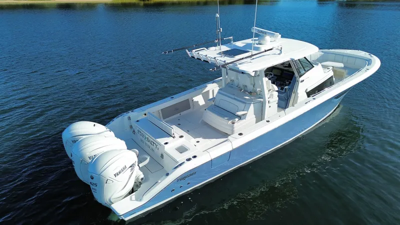 Slide: The Image of A white sport boat with three outboard engines on calm water. - 18