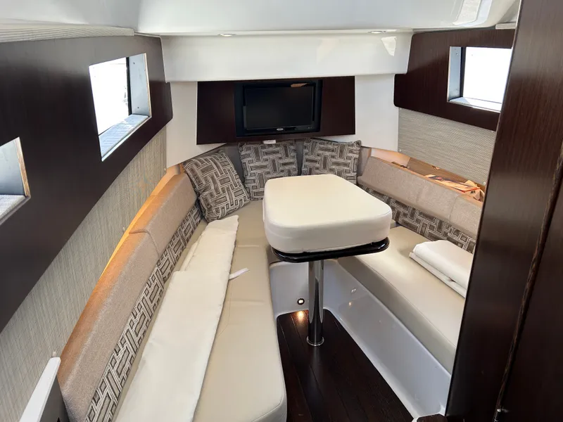 Slide: The Image of Interior of a 2021 Pursuit S 378 Sport with an elegant seating area and table. - 20