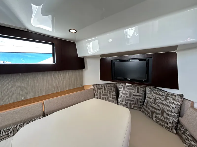 Slide: The Image of Interior of a 2021 Pursuit S 378 Sport with cozy seating area and TV. - 21
