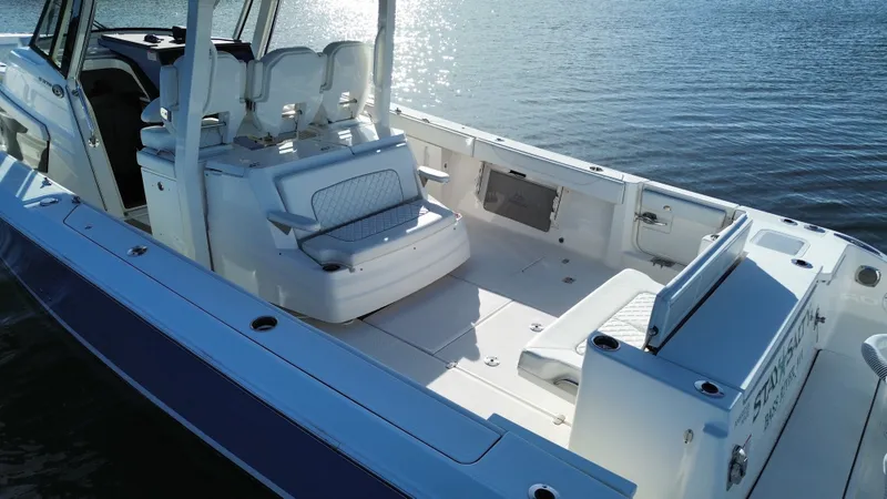 Slide: The Image of The image shows a 2021 Pursuit S 378 Sport boat on the water. - 15