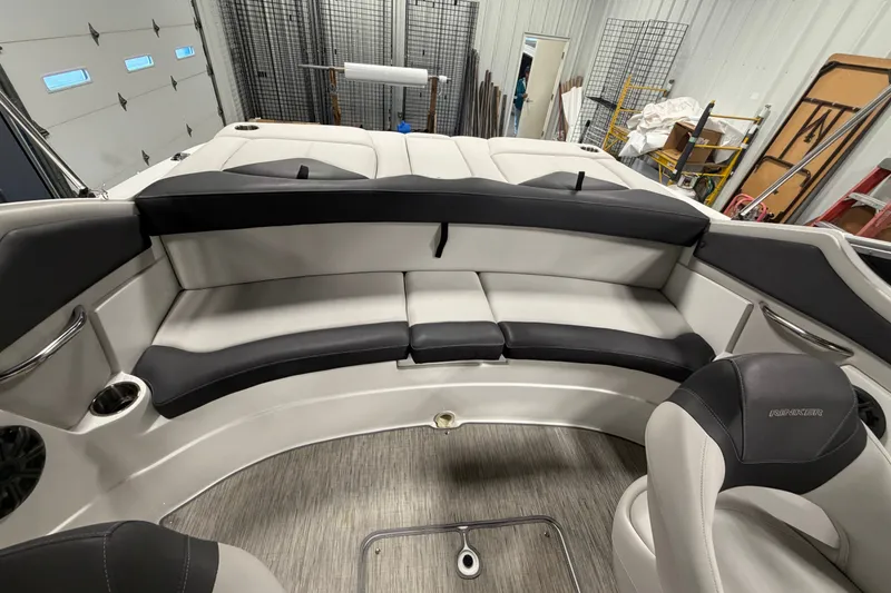 Slide: The Image of 2018 Rinker MTX 22 CC boat interior with curved seating and modern design. - 8