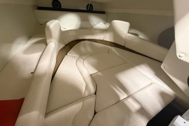 Slide: The Image of Interior cabin of a 2018 Rinker MTX 22 CC boat with beige seating. - 12
