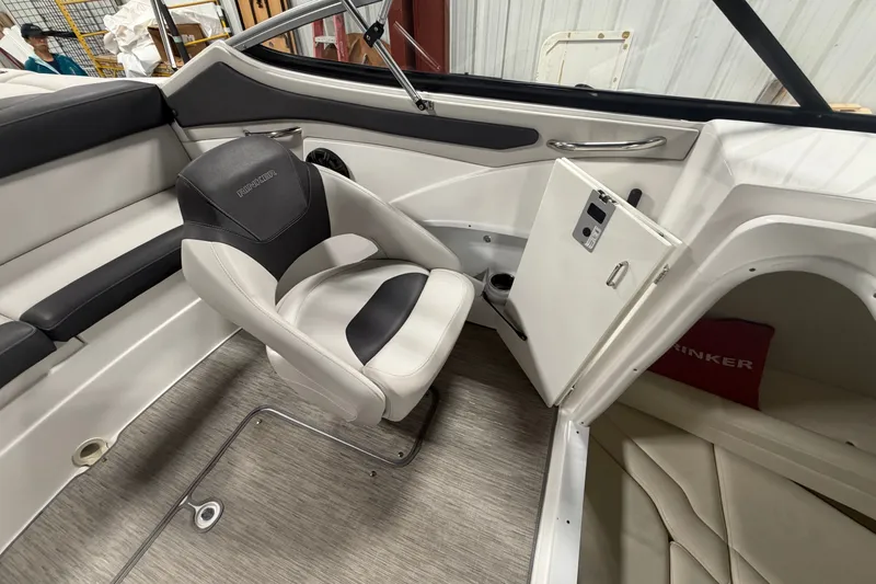 Slide: The Image of 2018 Rinker MTX 22 CC boat interior with seating and storage compartment. - 9