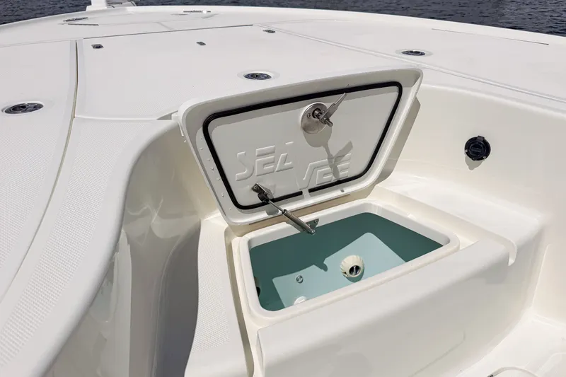 Slide: The Image of 2016 SeaVee 270Z boat with open storage compartment on deck. - 27