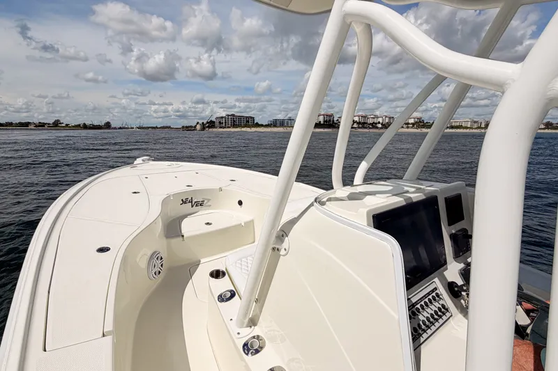 Slide: The Image of 2016 SeaVee 270Z boat on water, featuring sleek design and modern controls. - 19