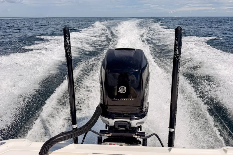 Slide: The Image of 2016 SeaVee 270Z boat cruising on open water, showcasing powerful outboard motor. - 40